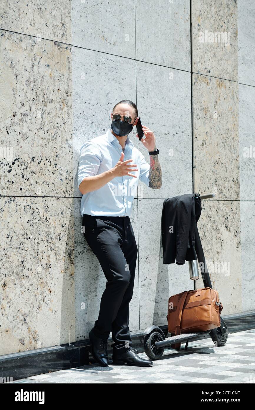 Angry businessman talking on phone Stock Photo