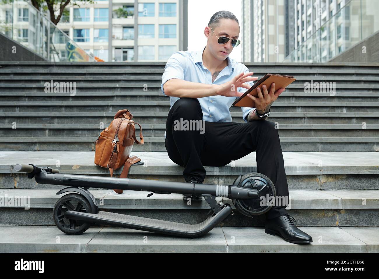 Entrepreneur using application on tablet Stock Photo