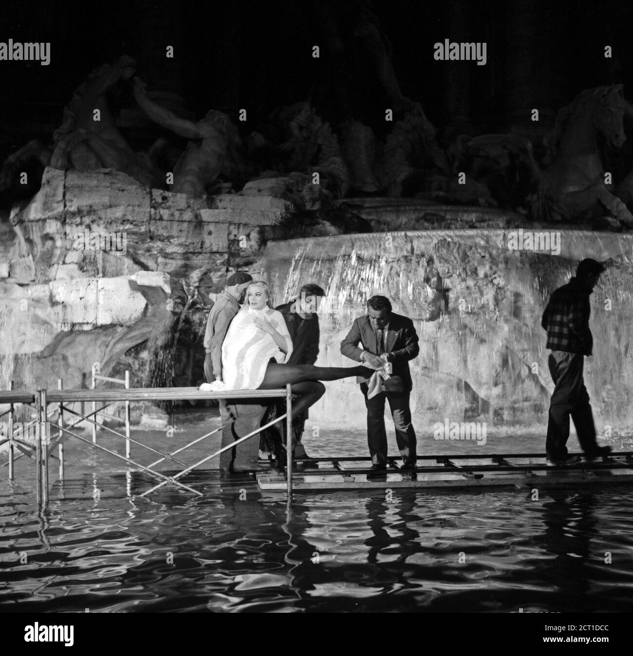 The Actress Anita Ekberg And Director Federico Fellini During The Processing Of The Scene Filmed In The Trevi Fountain Of The Film La Dolce Vita Rome 12 April 1959 Stock Photo Alamy