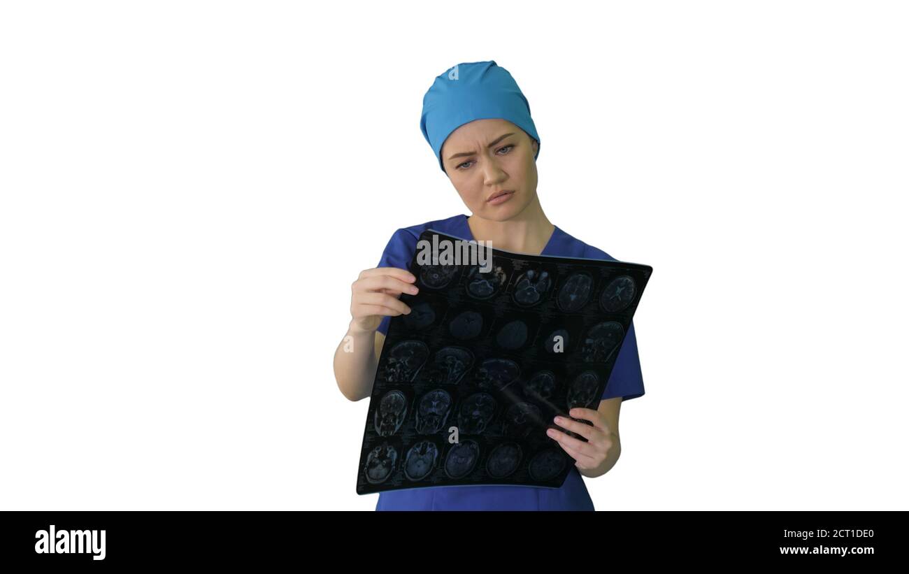 Female doctor looking at brain tomography on white background. Stock Photo
