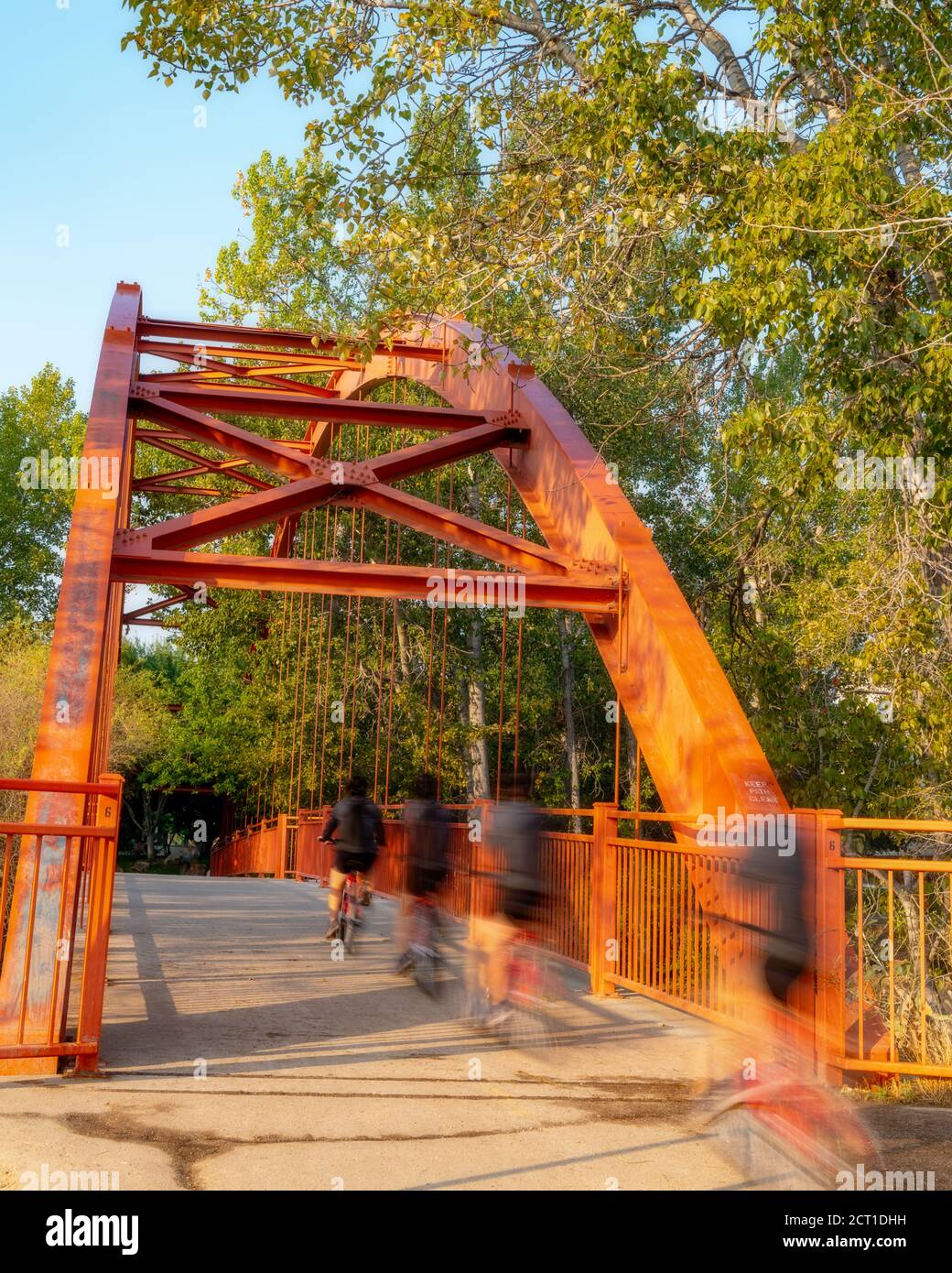 Boise River bridge with multiple image bike rider Stock Photo - Alamy