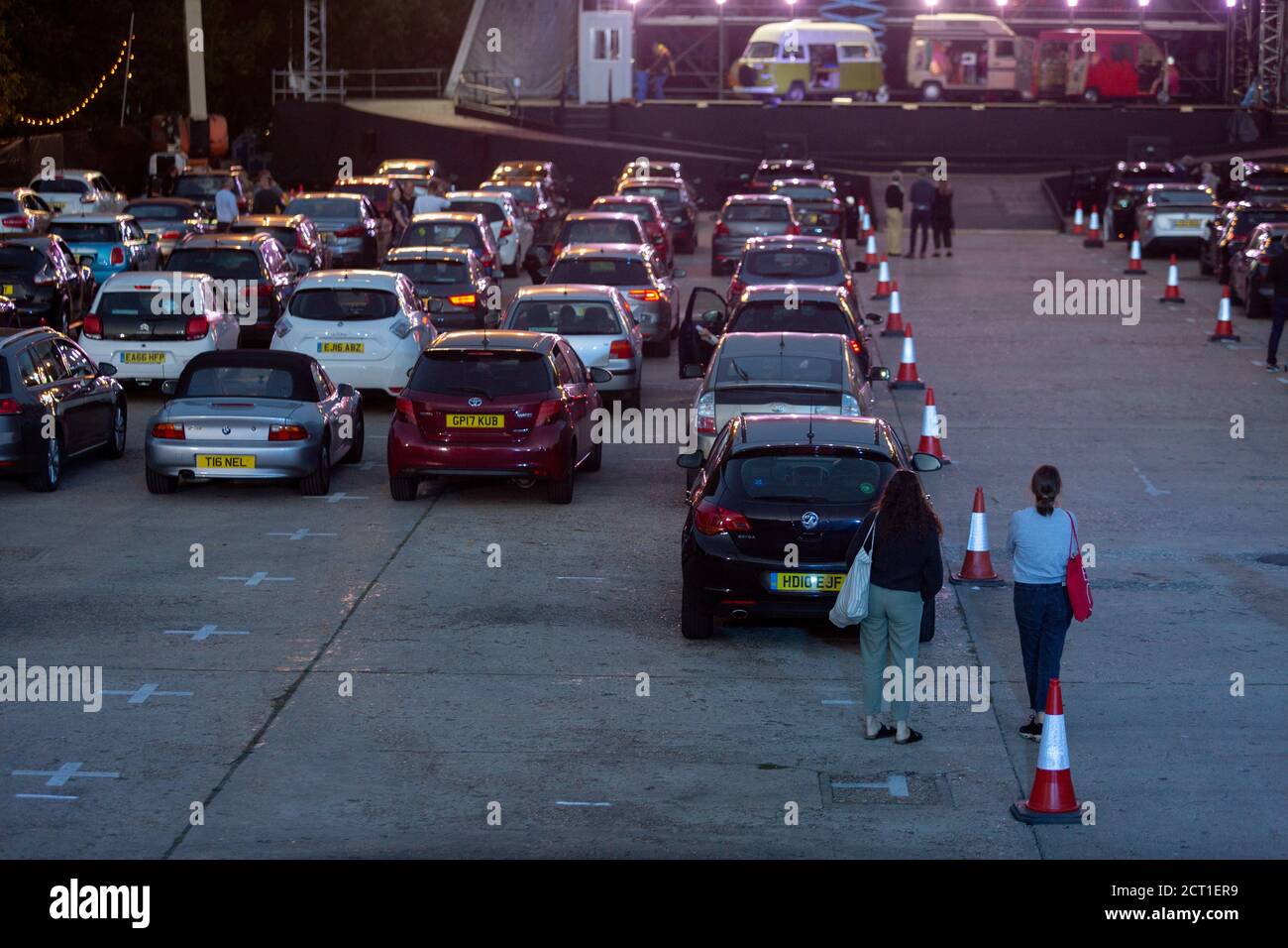 The car park fills up before the technical rehearsal of Puccini's La bohème is performed by members of  English National Opera (ENO) as a drive-in (ENO Drive and Live) at Alexandra Palace, on 18th September 2020, in London, England. This is Europe's first live drive-in opera production that audiences can safely experience from their cars and ENO's first public performance since the closure of their West End Colisseum home venue, because of the Coronavirus pandemic lockdown in March. As per the latest government advice. Each bubbled group consists of; 34 members of the ENO Orchestra, 20 ENO Cho Stock Photo