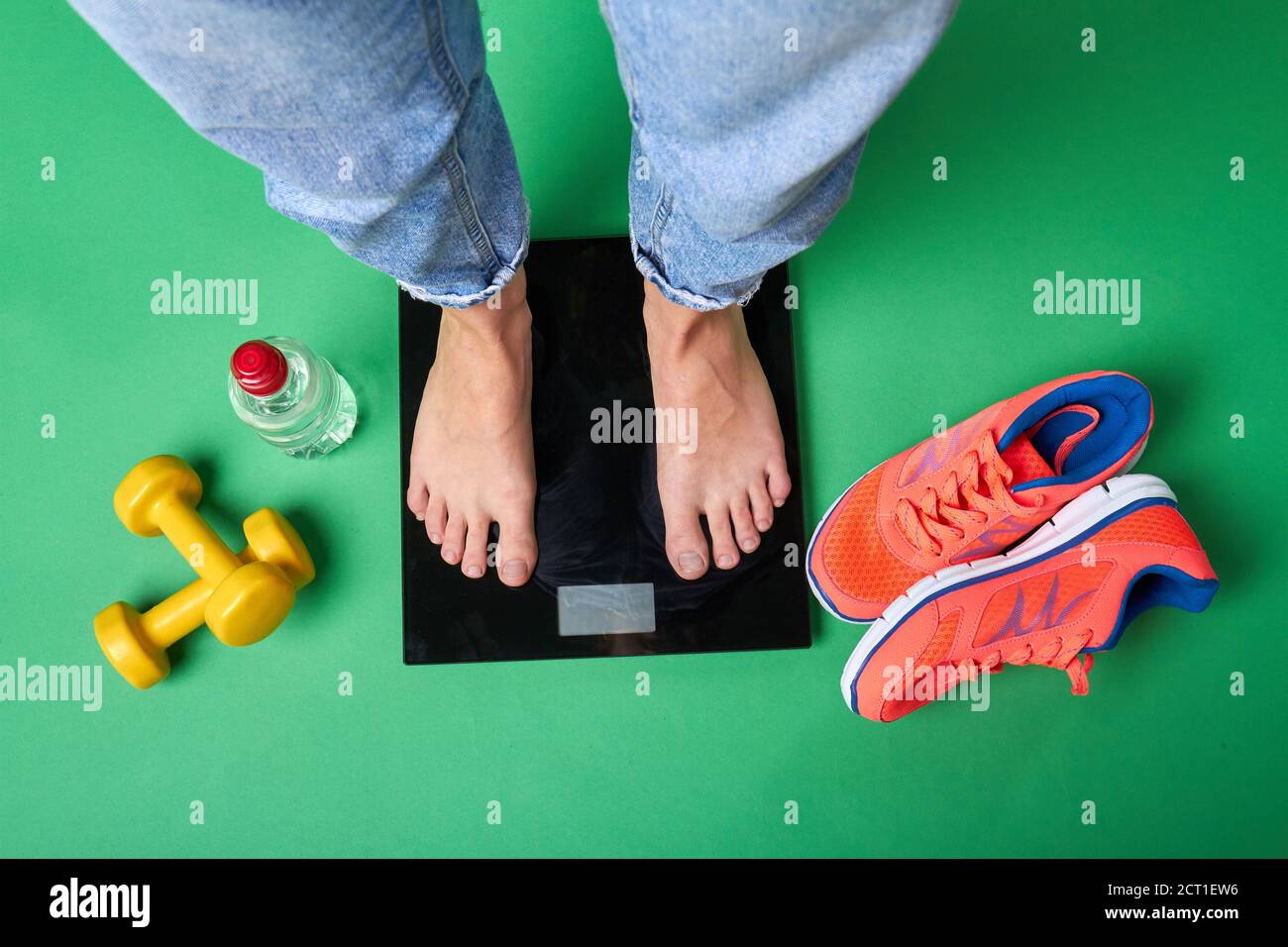 Sportsman's standing on bathroom scales Stock Photo Alamy