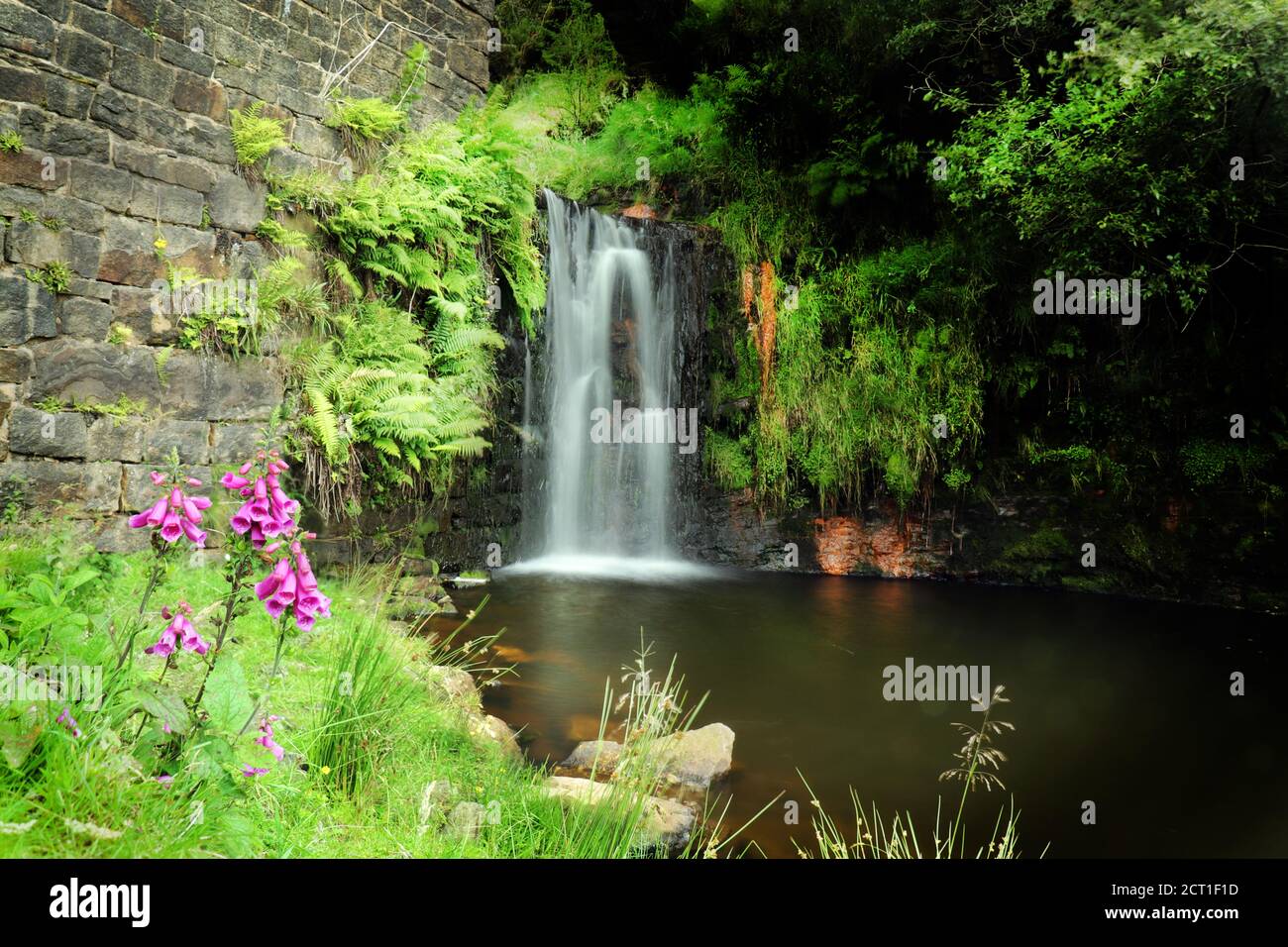 Waterfall near mill ruins in lancaashire Stock Photo