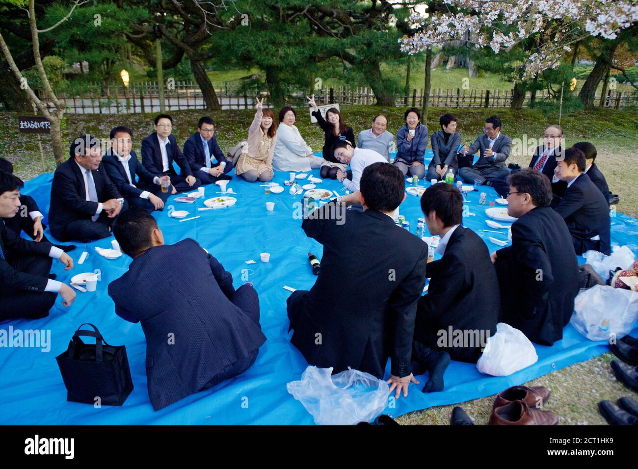 Japanese office worker having picnic in Ritsurin koen garden, Takamatsu city, Shikoku, Japan 2012. Stock Photo