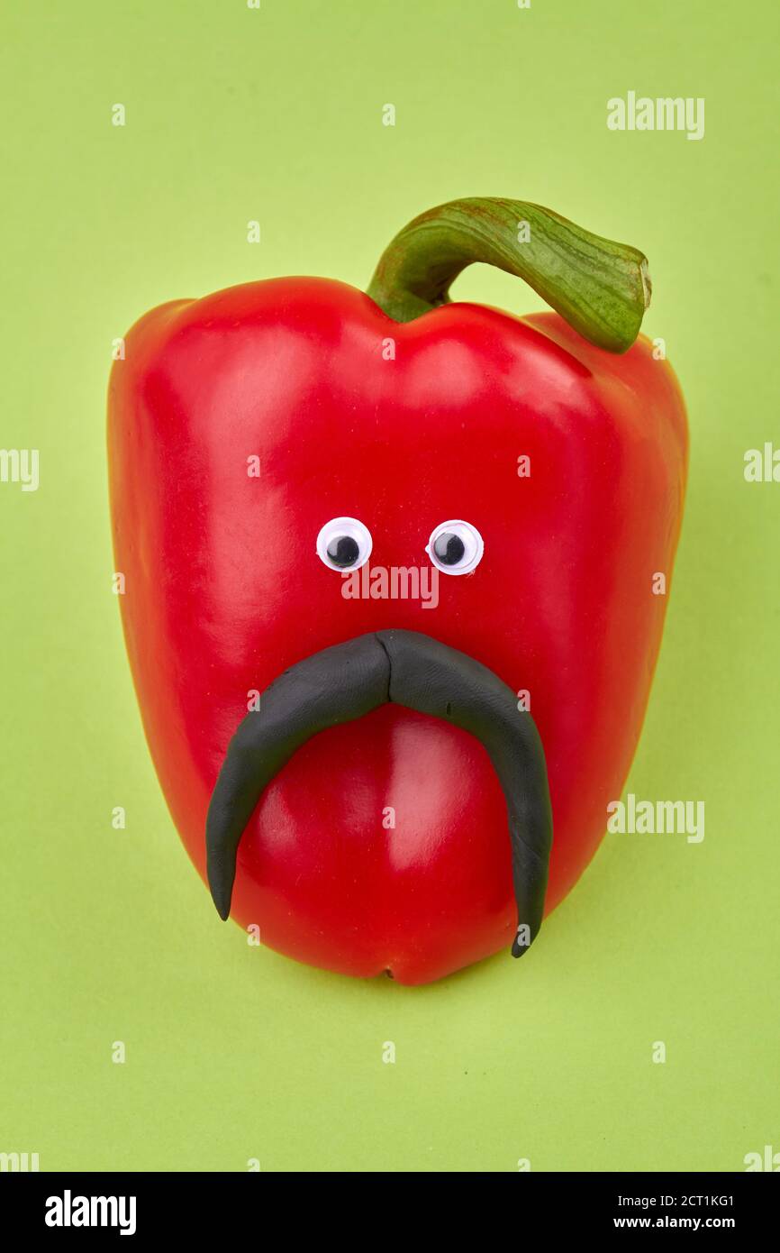 Red bell pepper with eyes and mustache Stock Photo Alamy