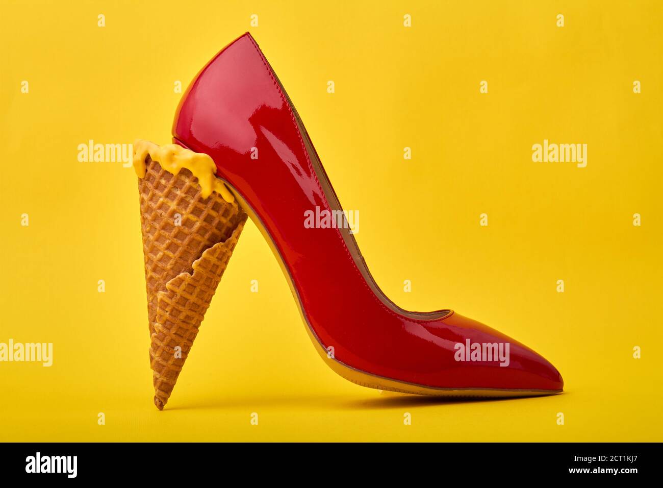 Ice cream cone's used as a high heel Stock Photo Alamy