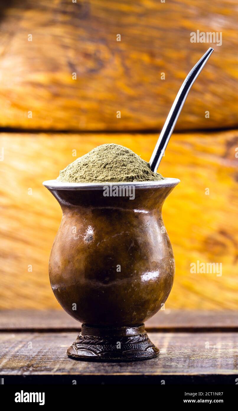 Yerba mate tea in wooden bowl on wooden table. Traditional drink from Brazil,  Argentina, Paraguay and South America Stock Photo - Alamy