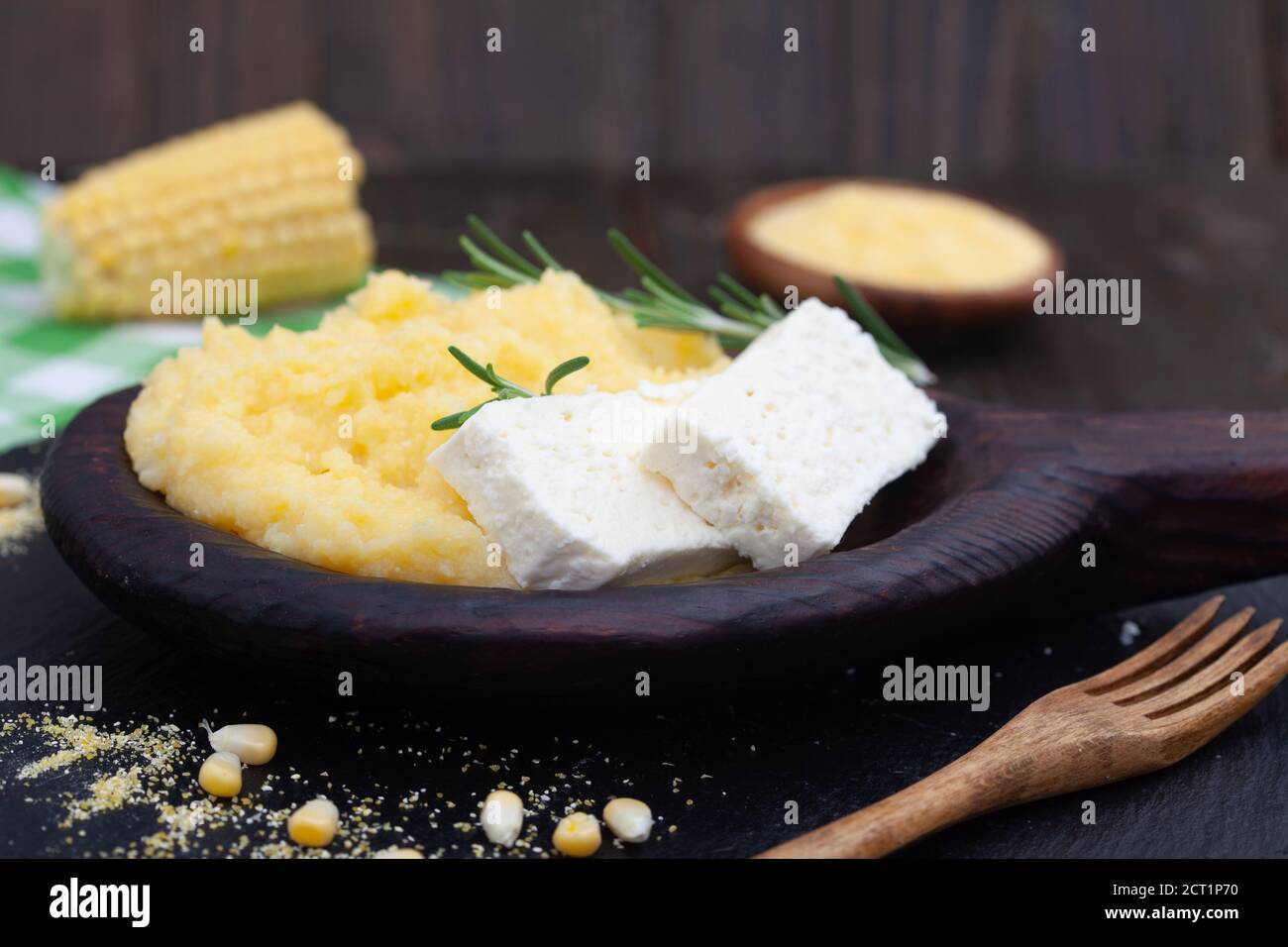 Mamaliga or polenta porridge made out of yellow maize flour. Homemade palenta with cheese, traditional meal on Balkan. Stock Photo