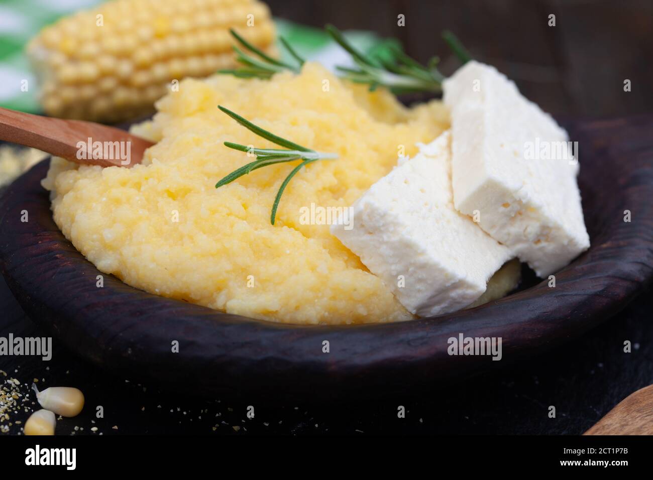 Mamaliga or polenta porridge made out of yellow maize flour. Homemade palenta with cheese, traditional meal on Balkan. Stock Photo