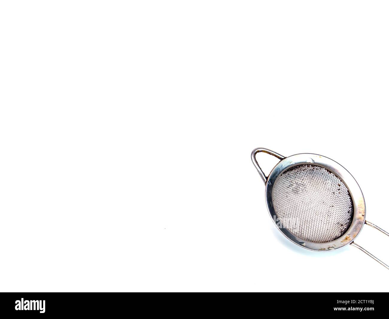 Metal strainer for coffee and tea on a white background. Making tea and