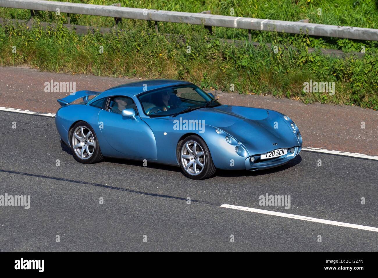 2002 Classic Le Mans Blue Tvr Tuscan; Vehicular traffic moving vehicles, cars driving vehicle on UK roads, motors, motoring on the M6 motorway highway network. Stock Photo