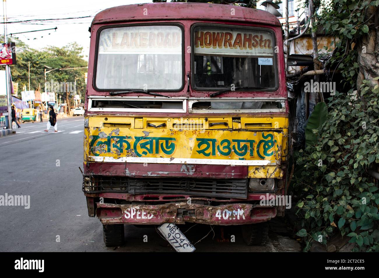 Kolkata, India - February 1, 2020: Front view of an old  local public transport bus in red, brown and yellow between Lakeroad and Howrah station Stock Photo