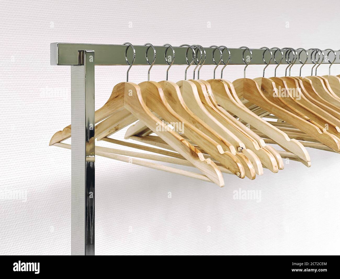 Clothes hangers on metal rail. Sale concept Stock Photo Alamy