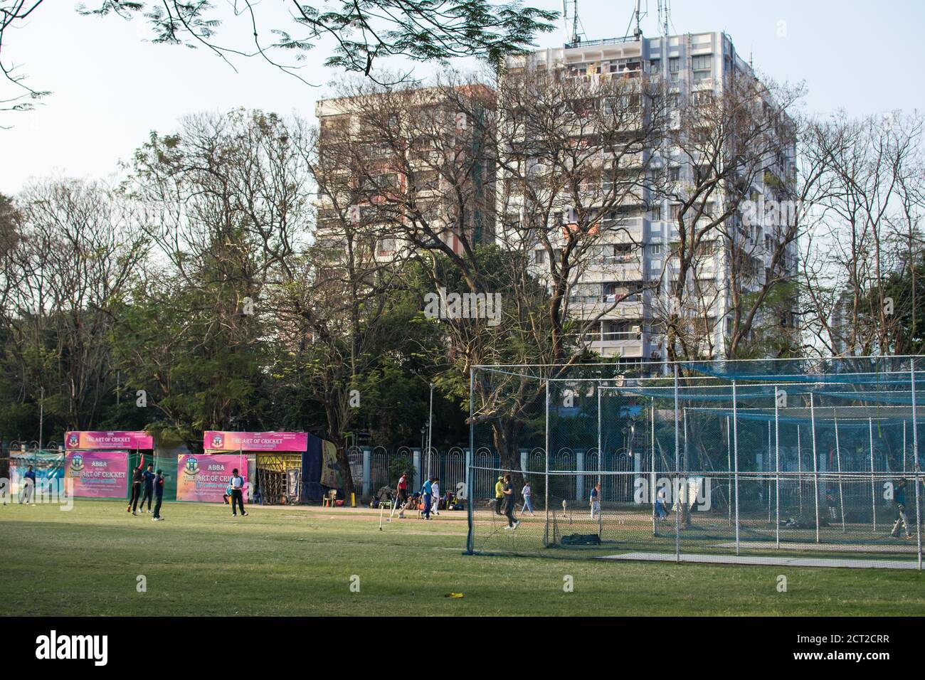 Kolkata, India - February 1, 2020: Several unidentified people plays cricket in everyday clothes in Minhaj Gardan park on February 1, 2020 in Kolkata Stock Photo