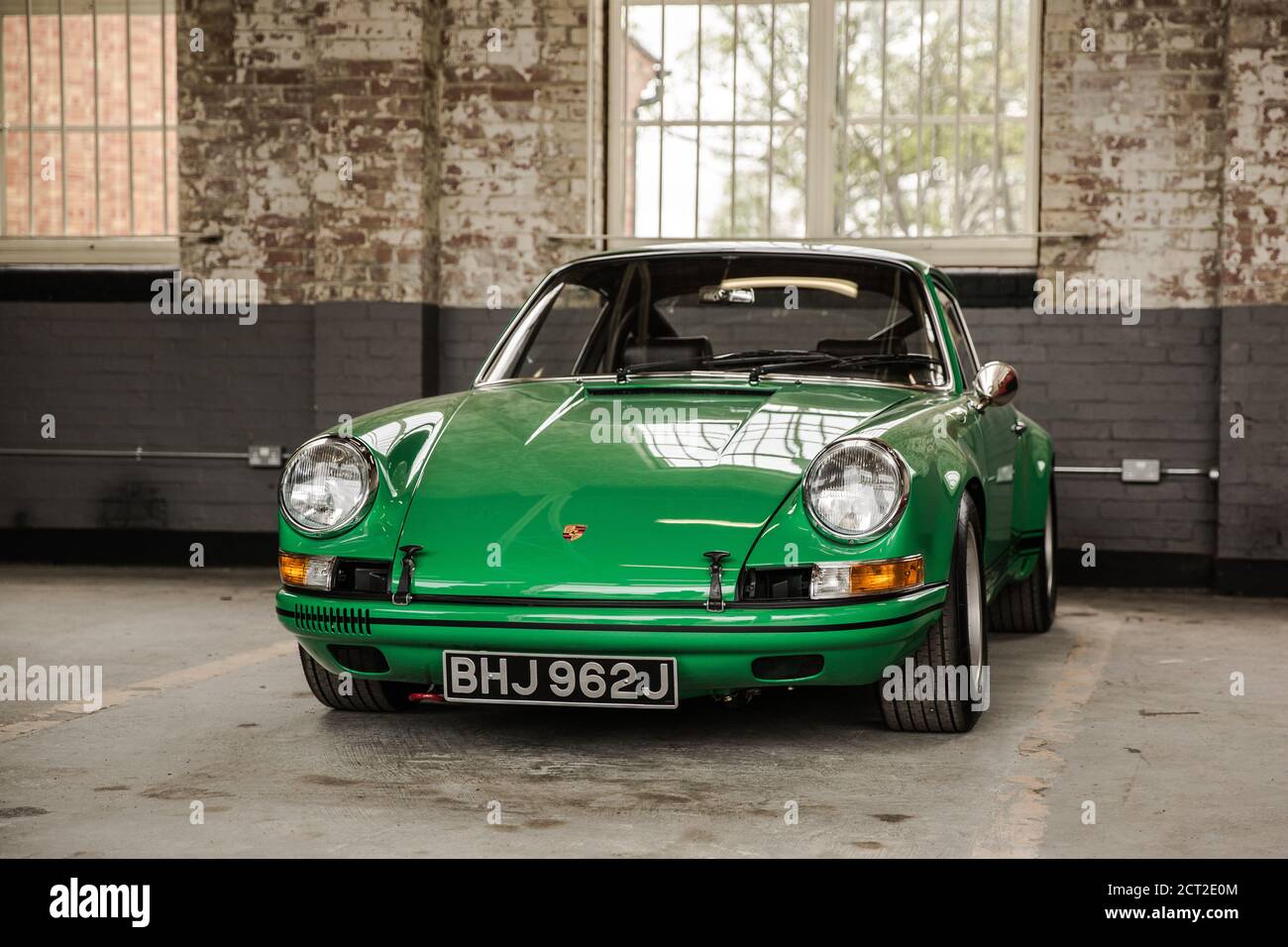 A green Porsche 911ST in a garage on display at the Bicester heritage Sunday Scramble Stock Photo