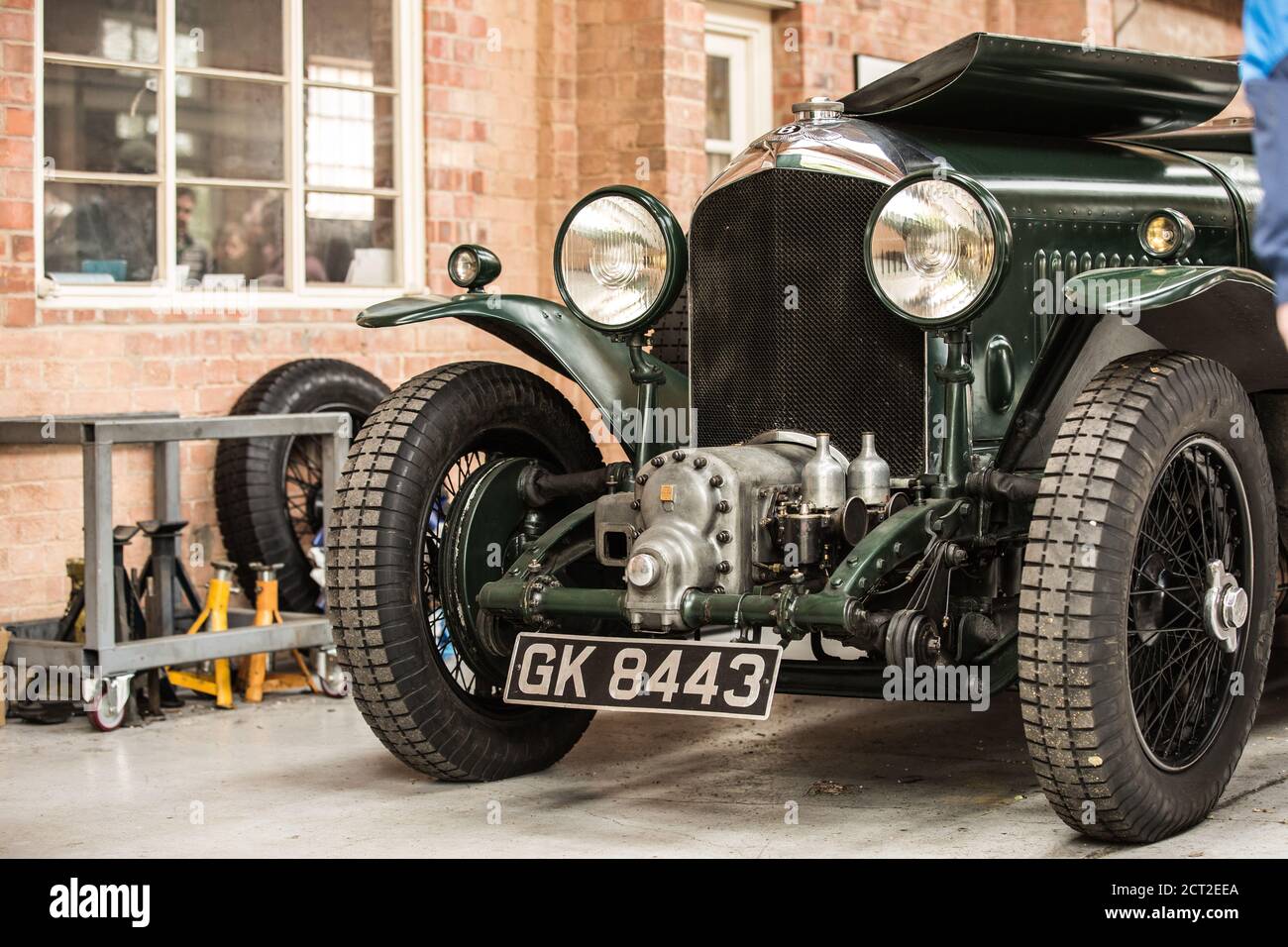 A 1931 Bentley 4 1/2 Supercharged Boat tail (The green hornet) being worked on in a garage at the Bicester Heritage Sunday Scramble Stock Photo