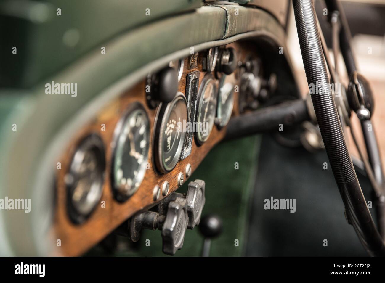 The dash board and steering wheel of a 1931 Bentley 4 1/2 Litre supercharged Boat tail Vintage car at the Bicester Heritage Sunday Scramble. Stock Photo