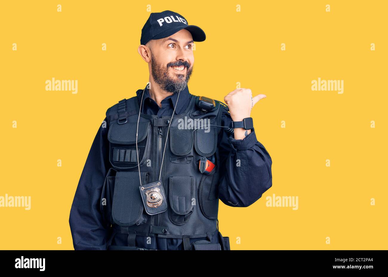 Young handsome man wearing police uniform smiling with happy face ...
