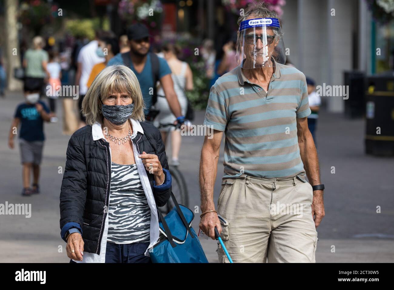 Staines-upon-Thames, UK. 20th September, 2020. Shoppers wear face coverings and a visor to help prevent the spread of the coronavirus. The Borough of Spelthorne, of which Staines-upon-Thames forms part along with Ashford, Sunbury-upon-Thames, Stanwell, Shepperton and Laleham, has been declared an Ôarea of concernÕ for COVID-19 by the government following a marked rise in coronavirus infections which is inconsistent with other areas of Surrey. Credit: Mark Kerrison/Alamy Live News Stock Photo