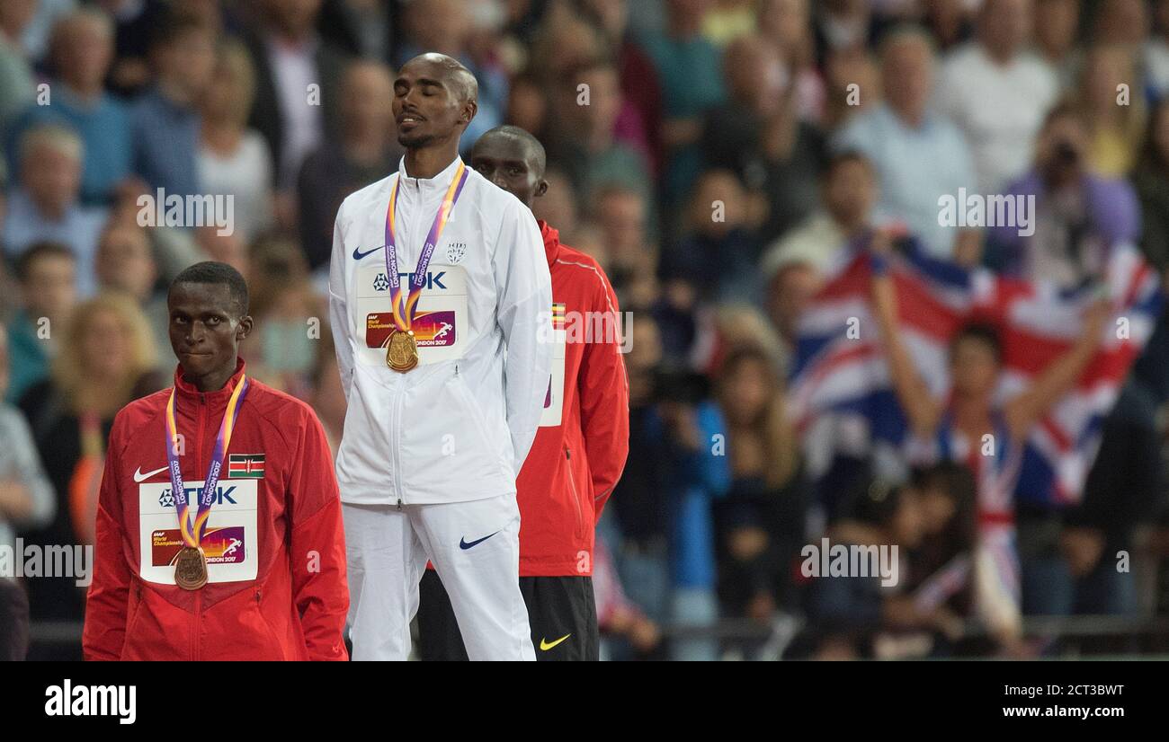 Mo Farah on the medal podium during the National Anthem after wining  the 10,000m. World Athletics Championships.Picture : © Mark Pain / Alamy Stock Photo