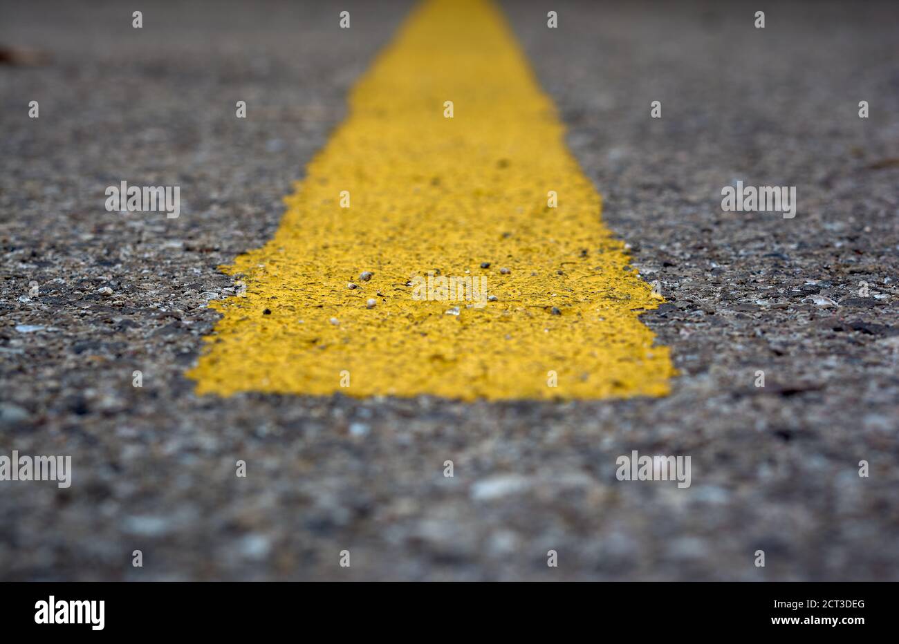 detail of a horizontal yellow line painted on the asphalt Stock Photo