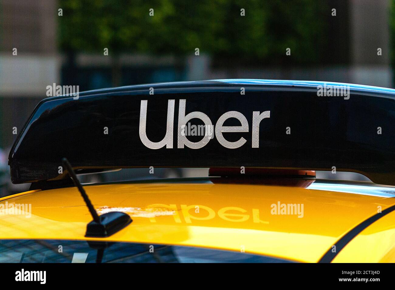 Uber logo icon on top of yellow taxi cab, close up - Moscow, 09//09/2020 Stock Photo