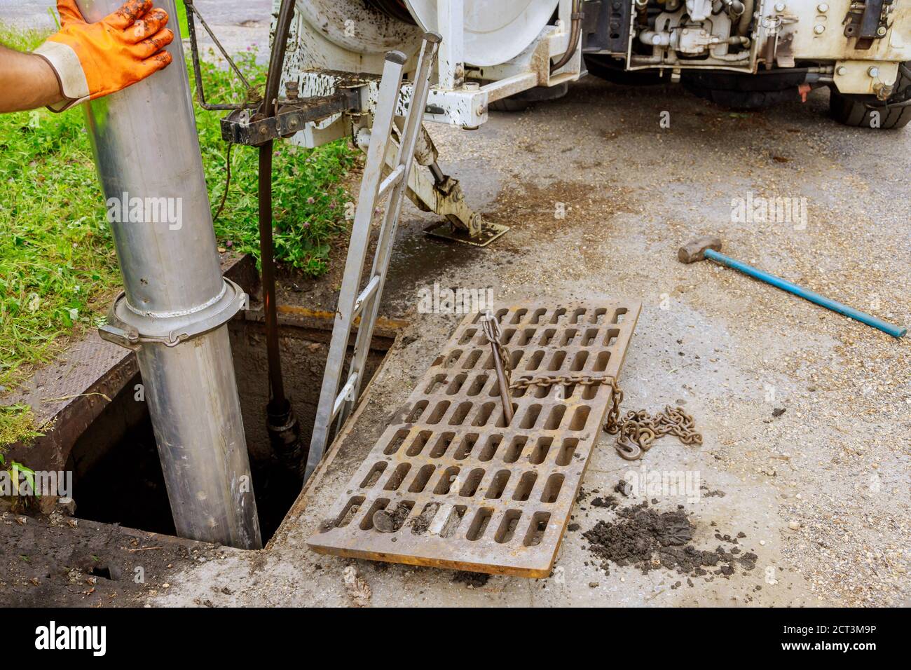 Cleaning the sewer system special equipment on utility service in the town. Stock Photo