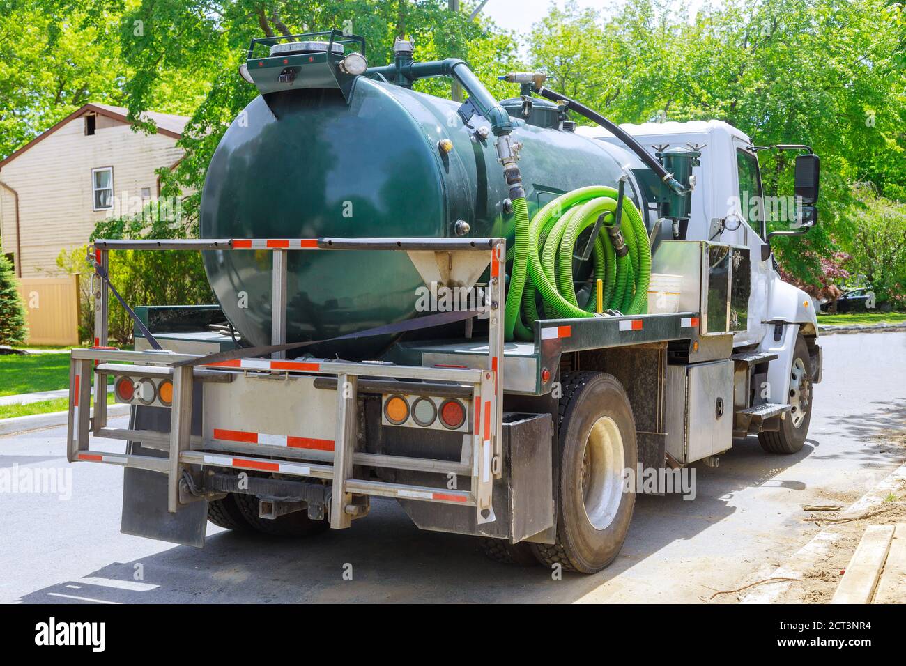 Vacuum waste truck on the cleaning process portable bio toilet cabins