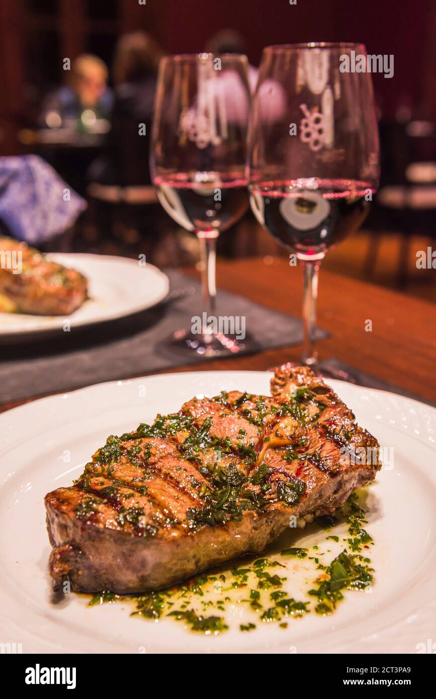 Argentinian Steak with red wine for dinner at a fine dining restaurant at a Bodega (winery) in the Maipu area of Mendoza, Mendoza Province, Argentina, South America Stock Photo
