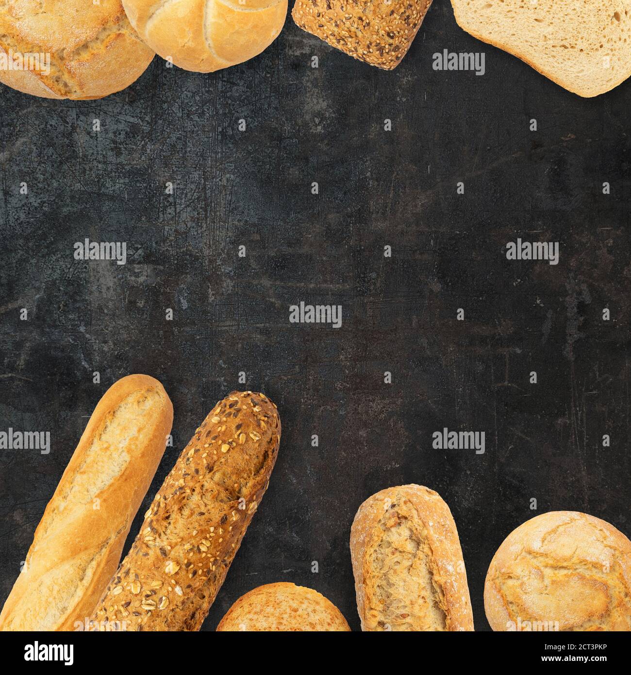 Isolated different kinds of bread on a black background. Photo of