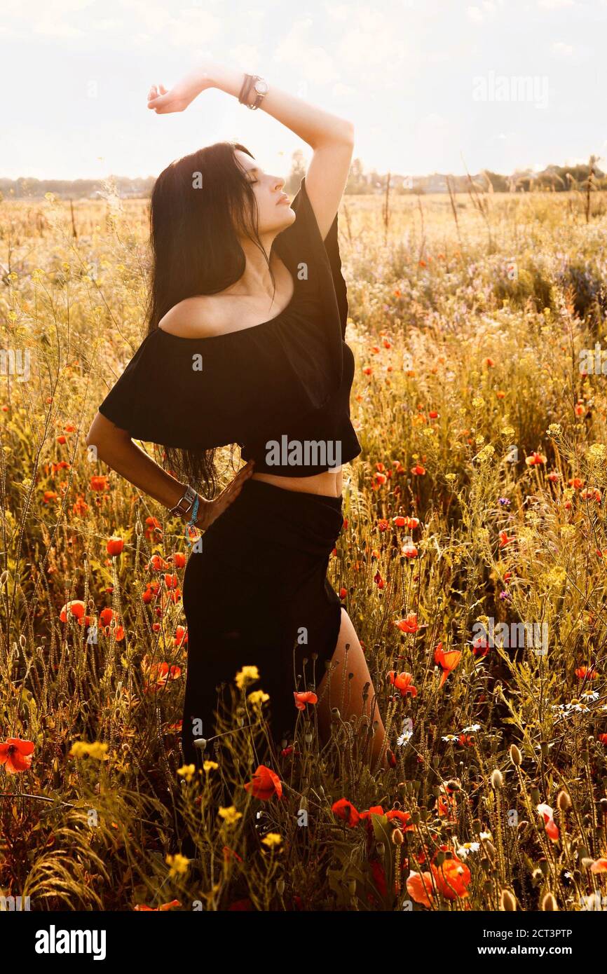 Young beautiful slim, fit brunette woman with dark long hair dancing in black latin style summer black dress suit off shoulders top and long skirt wit Stock Photo - Alamy Young beautiful slim, fit brunette woman with dark long hair dancing in black latin style summer black dress suit off shoulders top and long skirt wit Stock Photo - Alamy