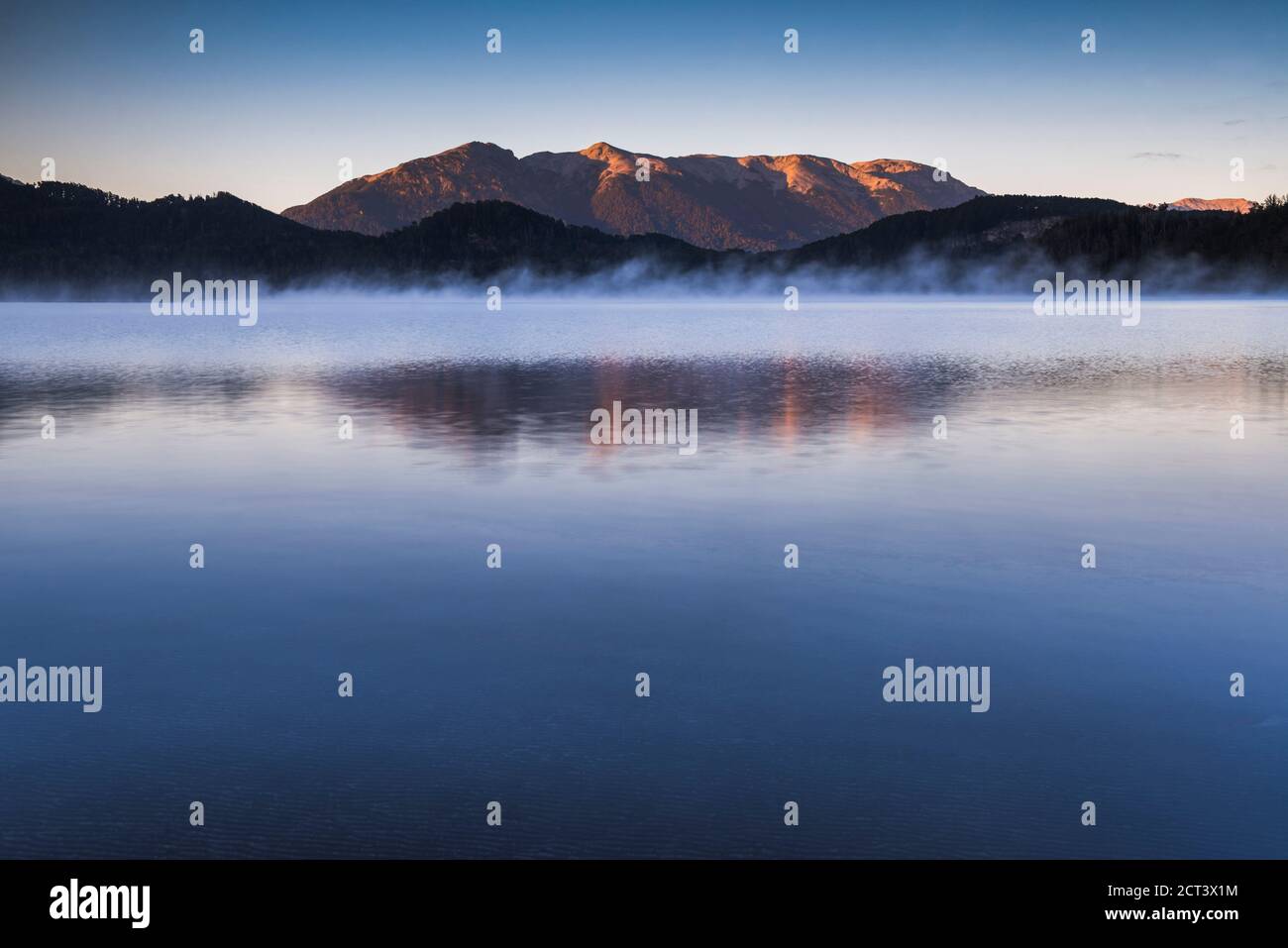 Misty sunrise at Nahuel Huapi Lake, Villa la Angostura, Neuquen, Patagonia, Argentina, background with copy space, South America, background with copy space Stock Photo