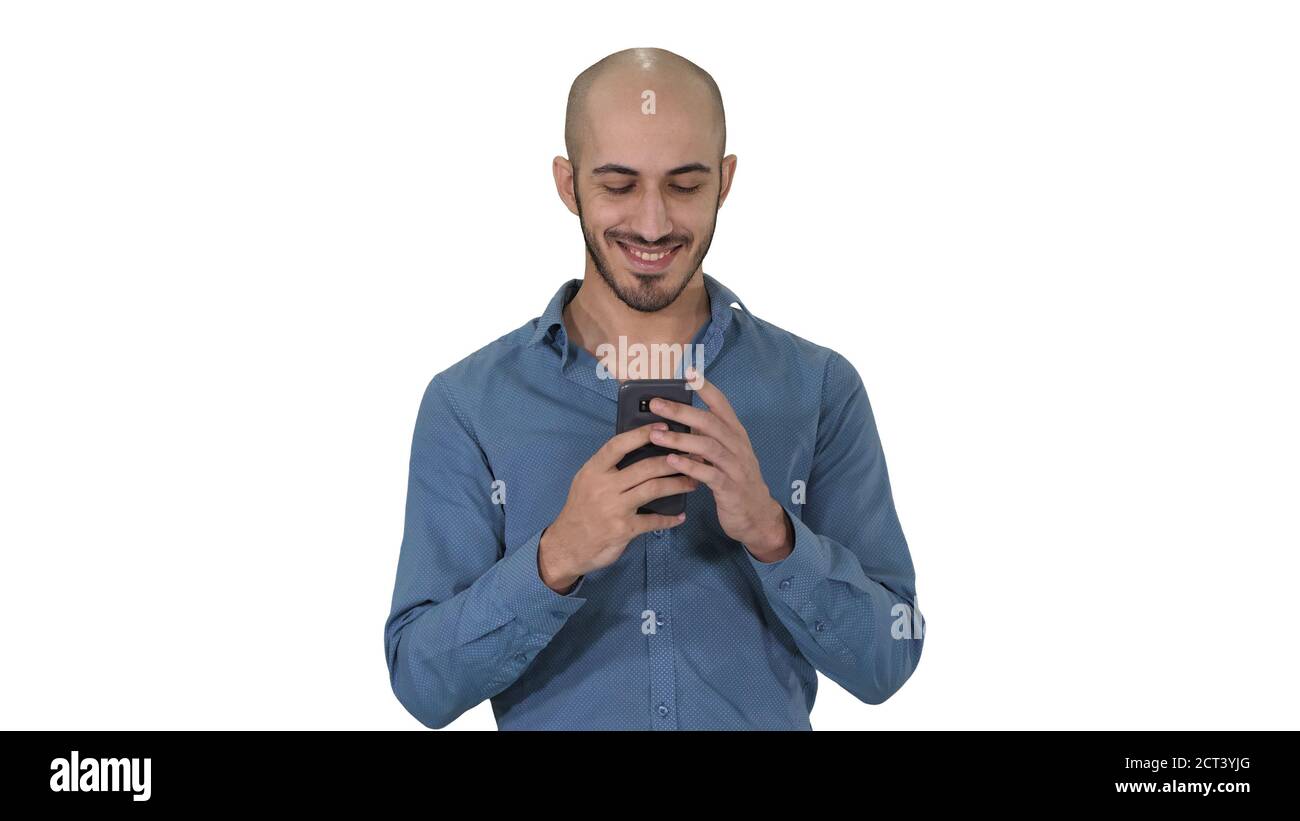 Casual Man Using Cell Smart Phone Writing Message on white background. Stock Photo