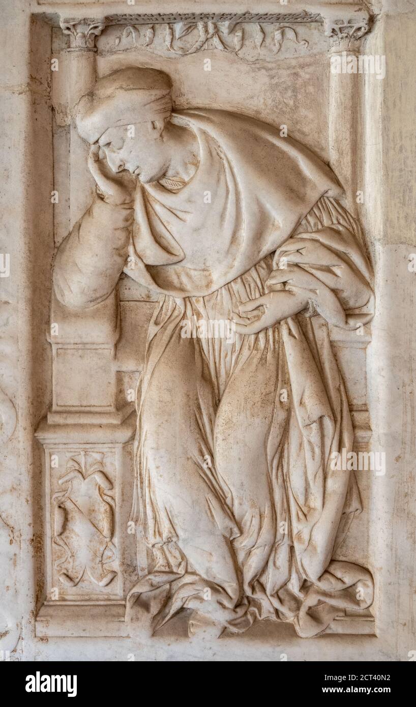Basilica of Saint John Lateran, San Giovanni in Laterano, Rome. Marble tomb slab of a Lateran Canon Priest in the Cloisters First half 16th century Stock Photo