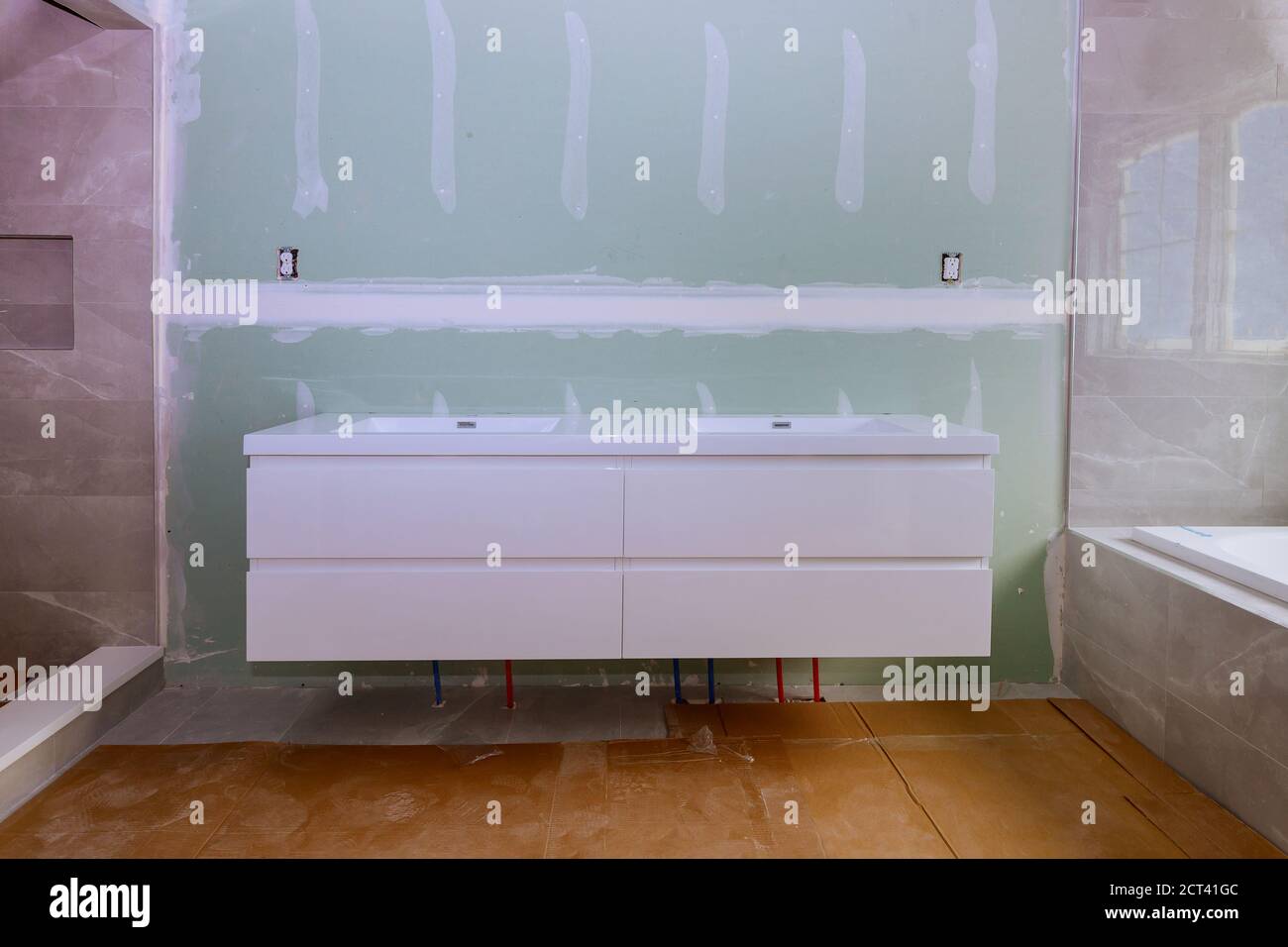 Designer renovation construction of master bathroom with shower