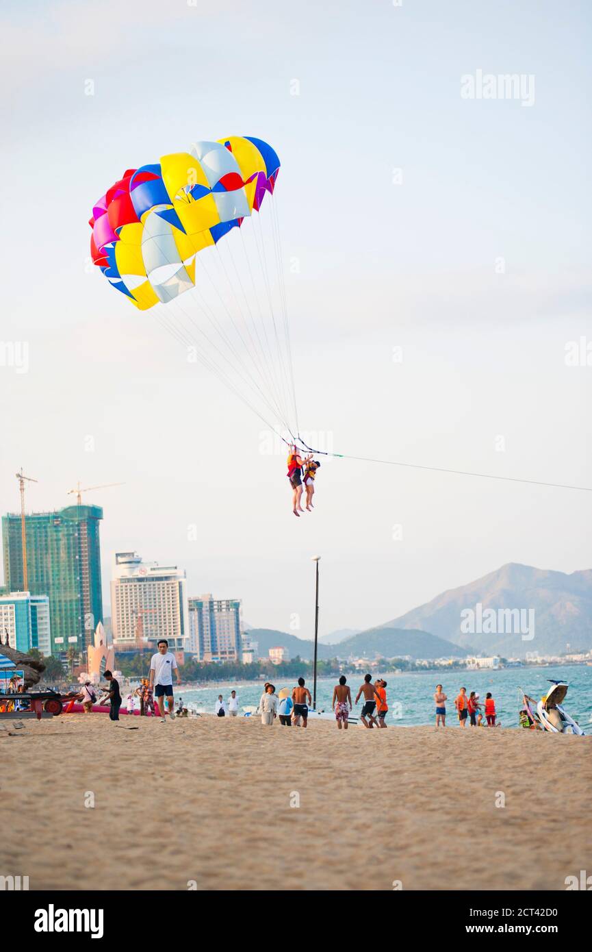 Couple of Tourists Parasailing at Nha Trang Beach, Vietnam, Southeast Asia Stock Photo