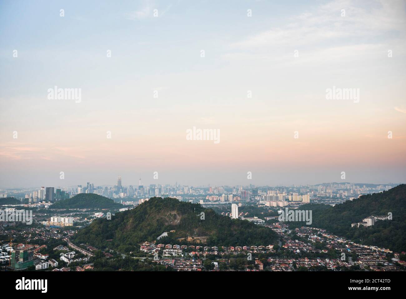Kuala Lumpur skyline seen at sunrise from Bukit Tabur Mountain, Malaysia, Southeast Asia Stock Photo