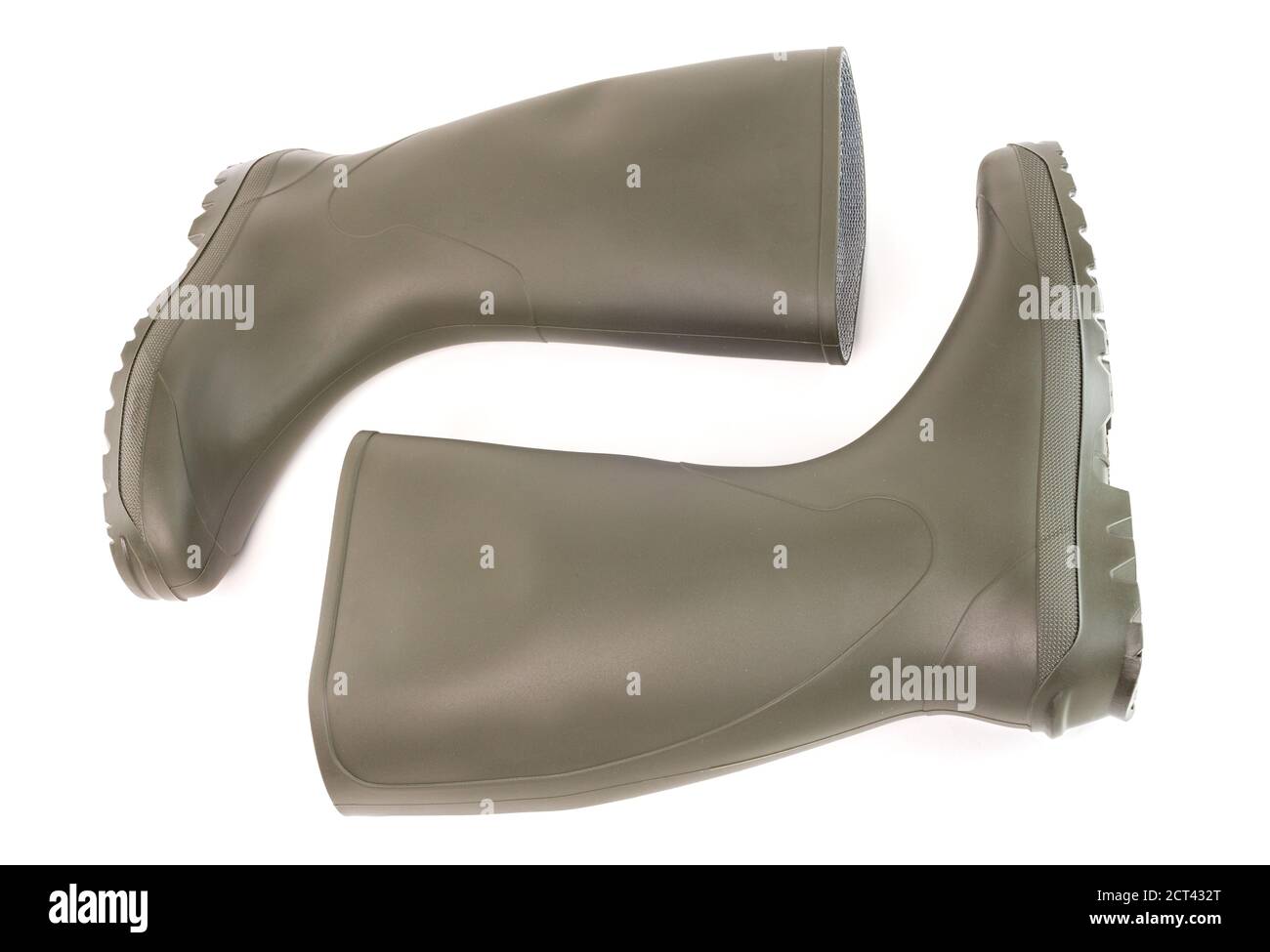 Pair of clean green rubber boots laying down isolated on white background. Front view. Stock Photo