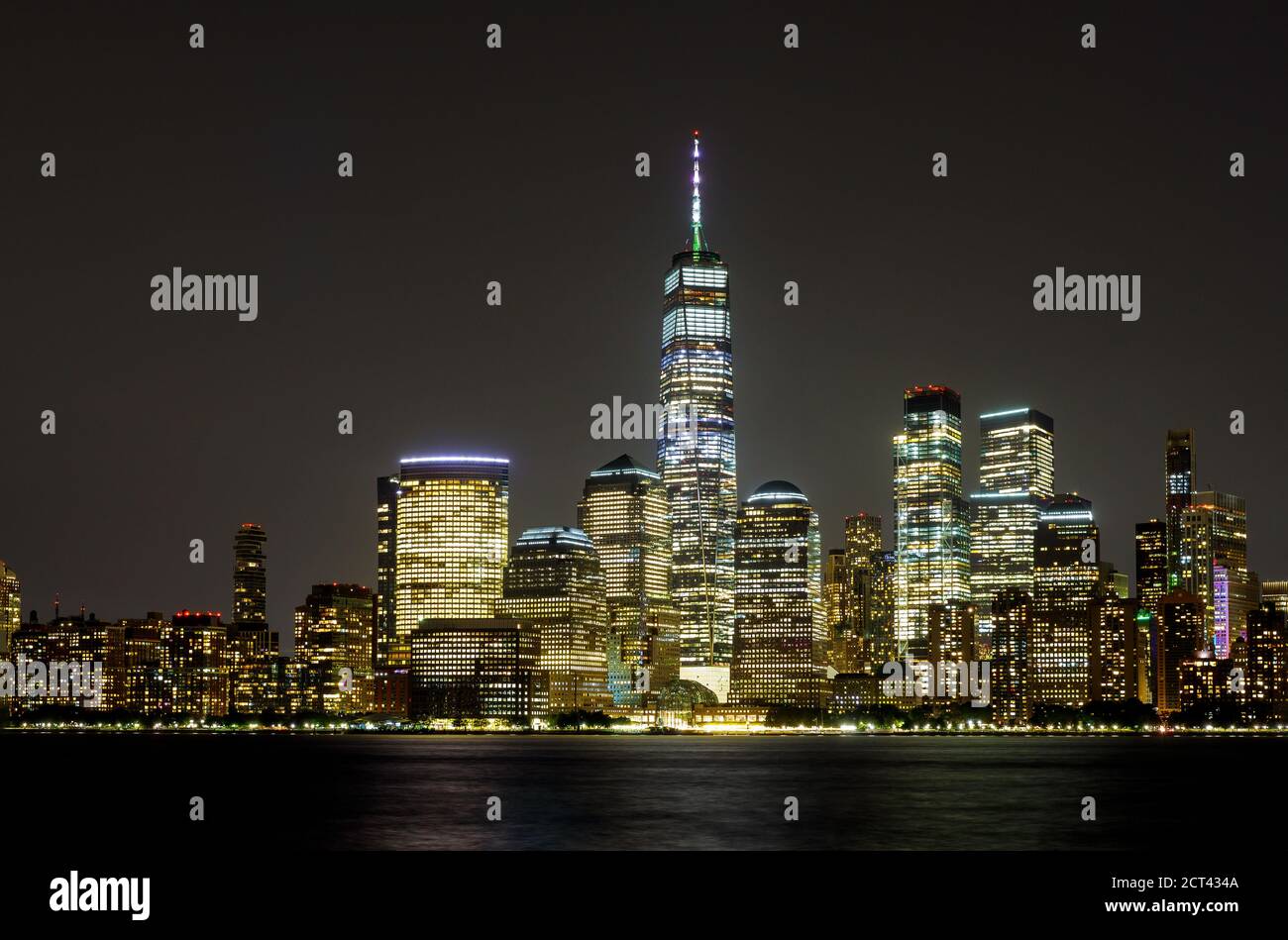 New York City Manhattan NY skyline panorama at night over Hudson river with reflections viewed from New Jersey USA Stock Photo