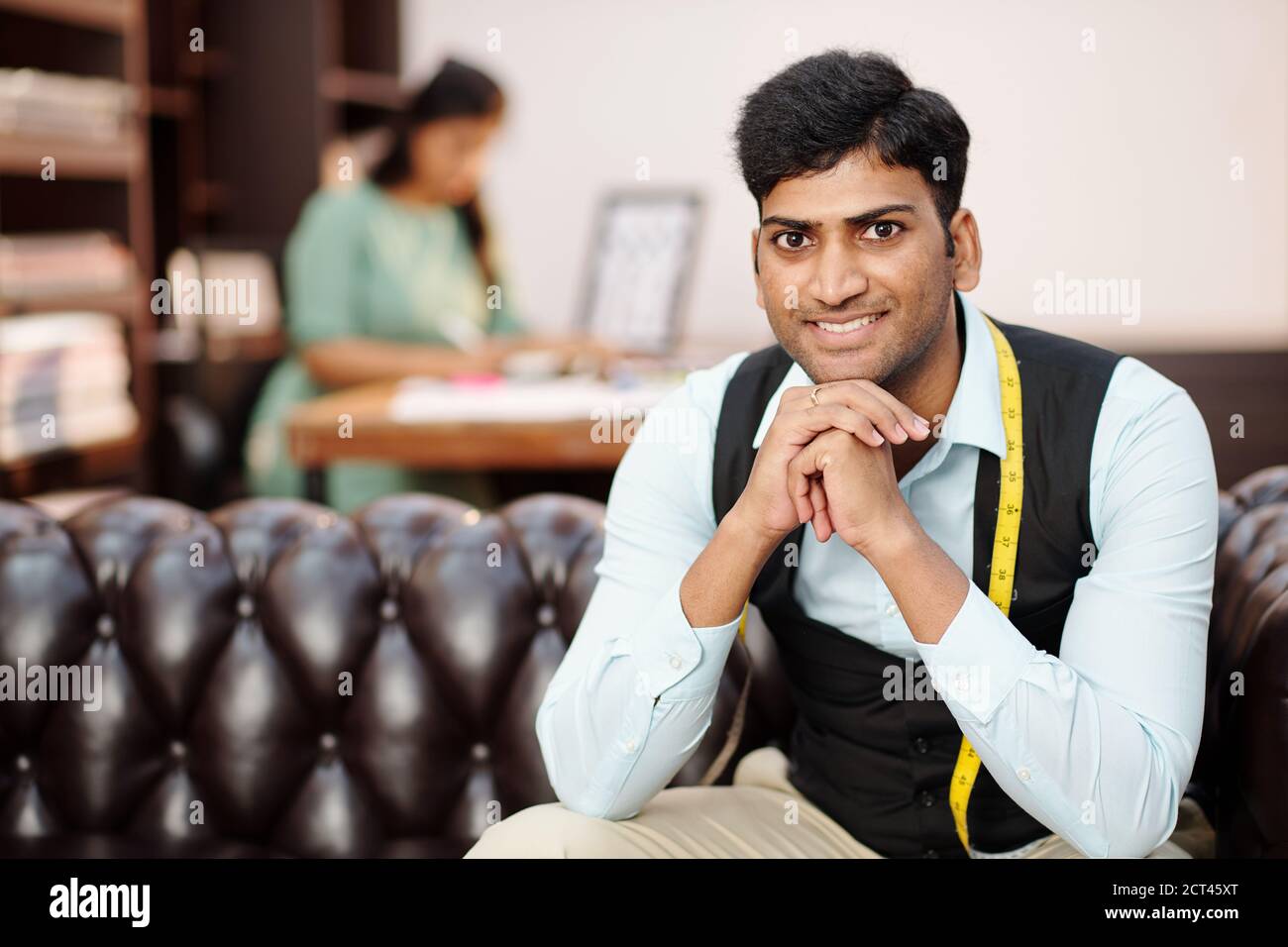 Handsome young Indian tailor Stock Photo