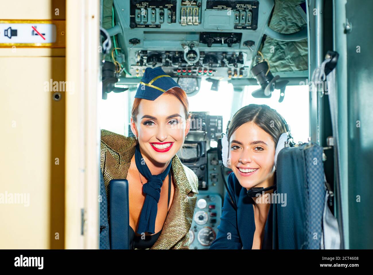 Beautiful woman pilot wearing uniform. Happy and successful flight