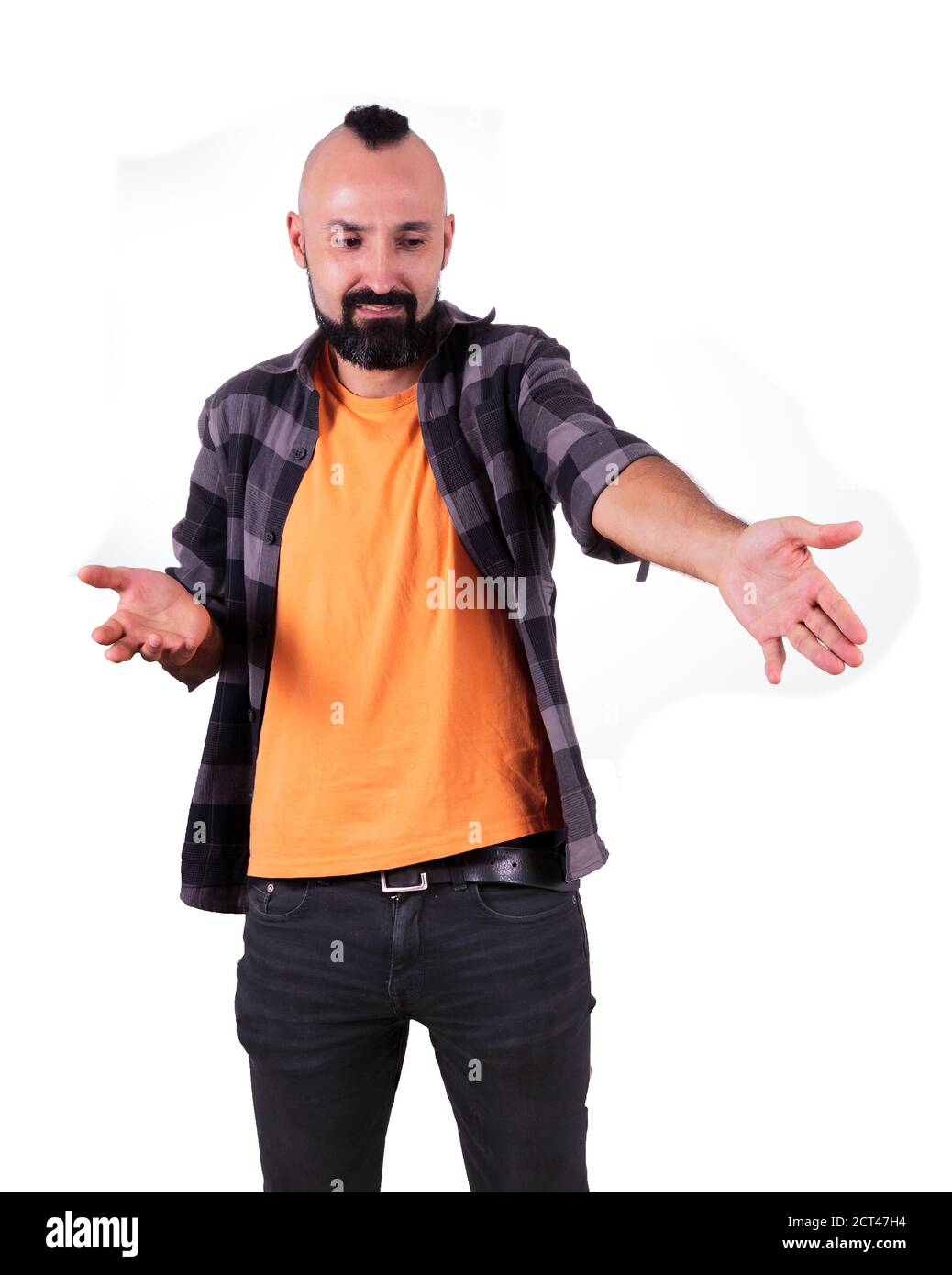 Young hispanic man pointing at something with disdain Stock Photo