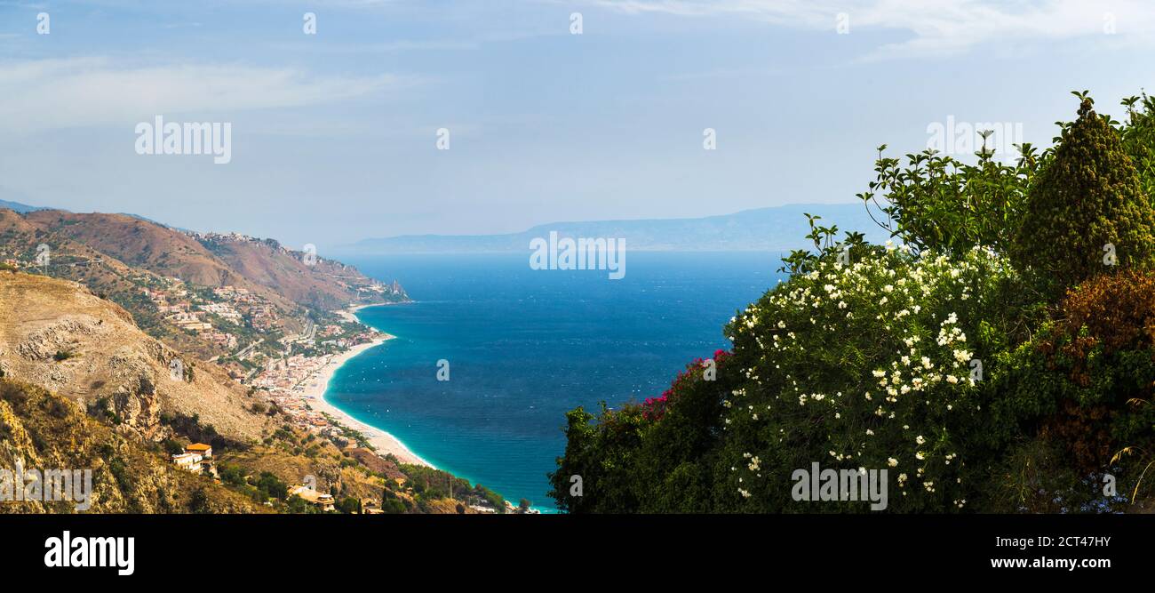 Panoramic photo of Letojanni Beach and Mazzeo Beach and the Ionian Sea (part of the Mediterranean Sea) seen from Taormina, East Coast of Sicily, Italy, Europe Stock Photo