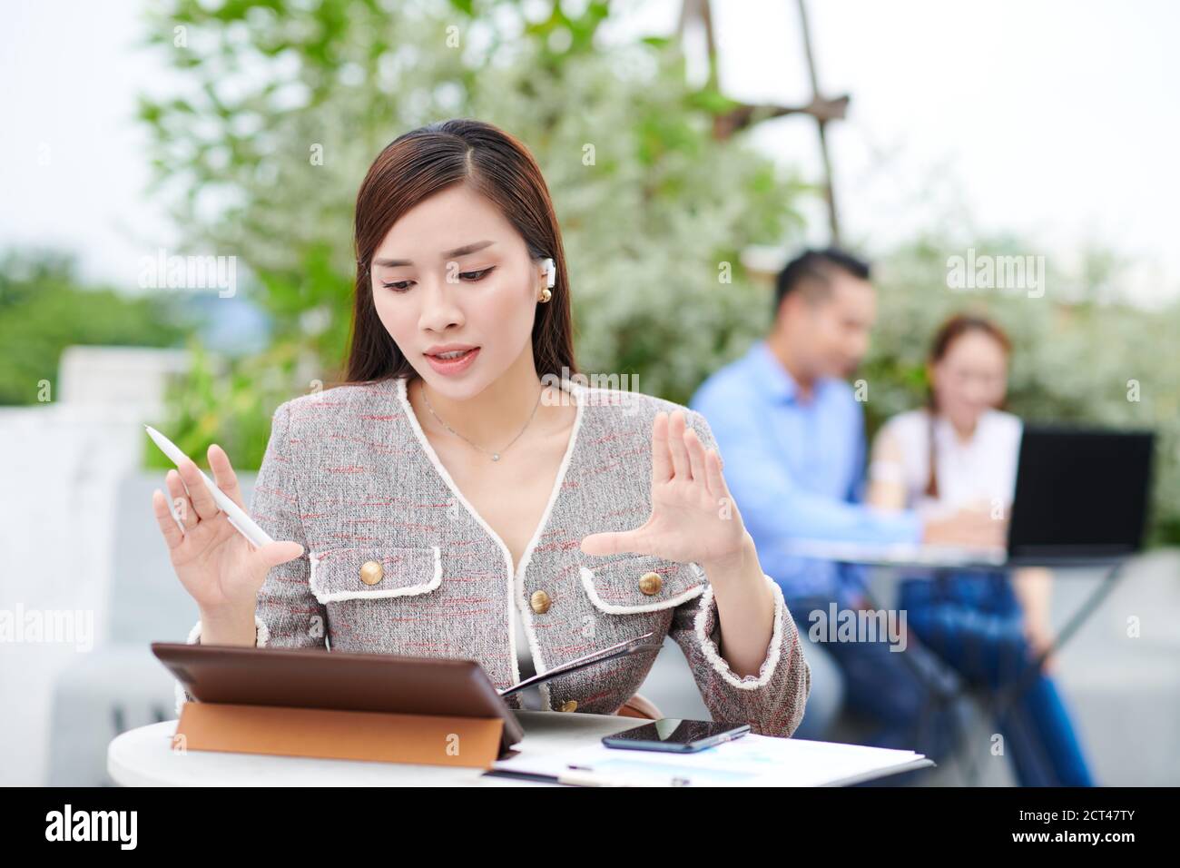 Entrepreneur having video call with team Stock Photo