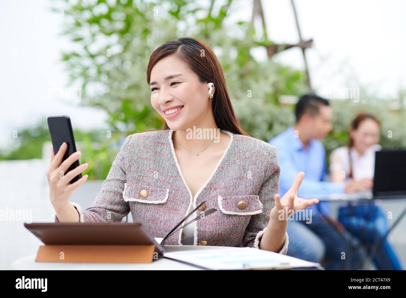 Video calling female entrepreneur Stock Photo