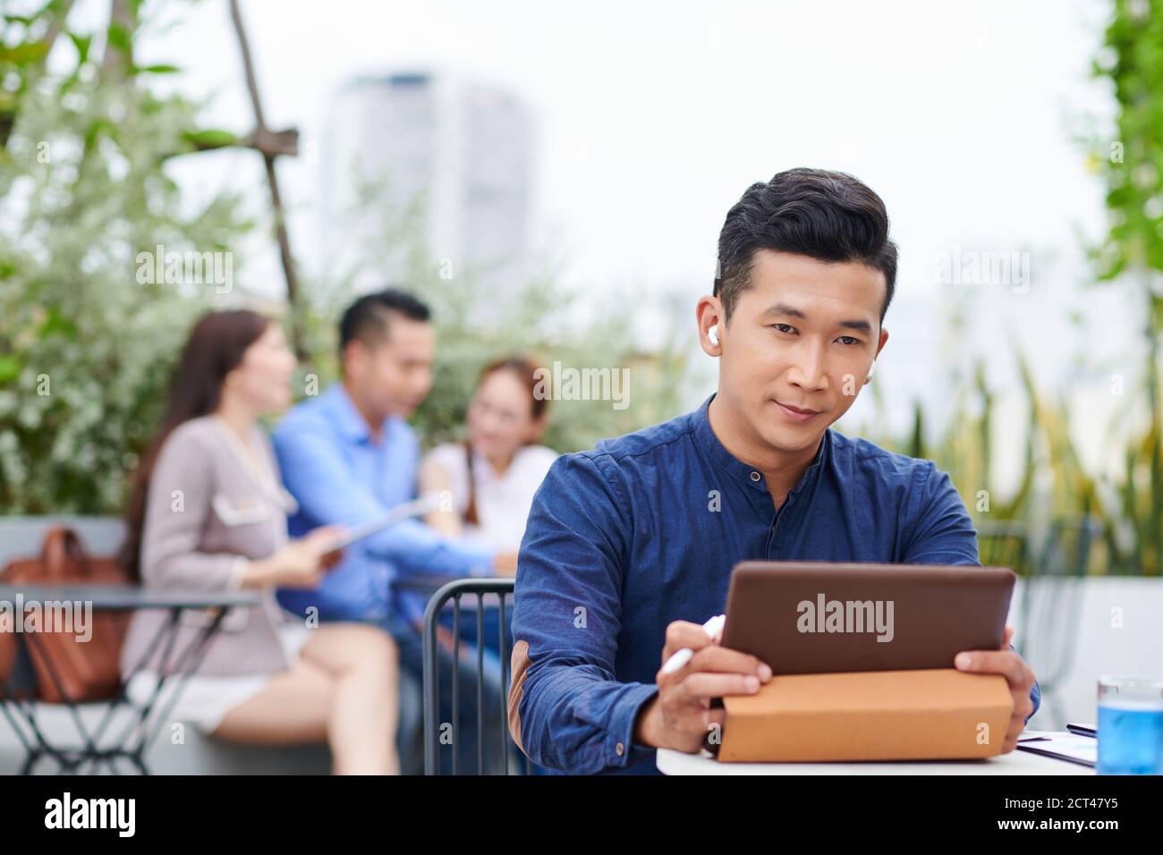 Businessman watching presentation on tablet Stock Photo