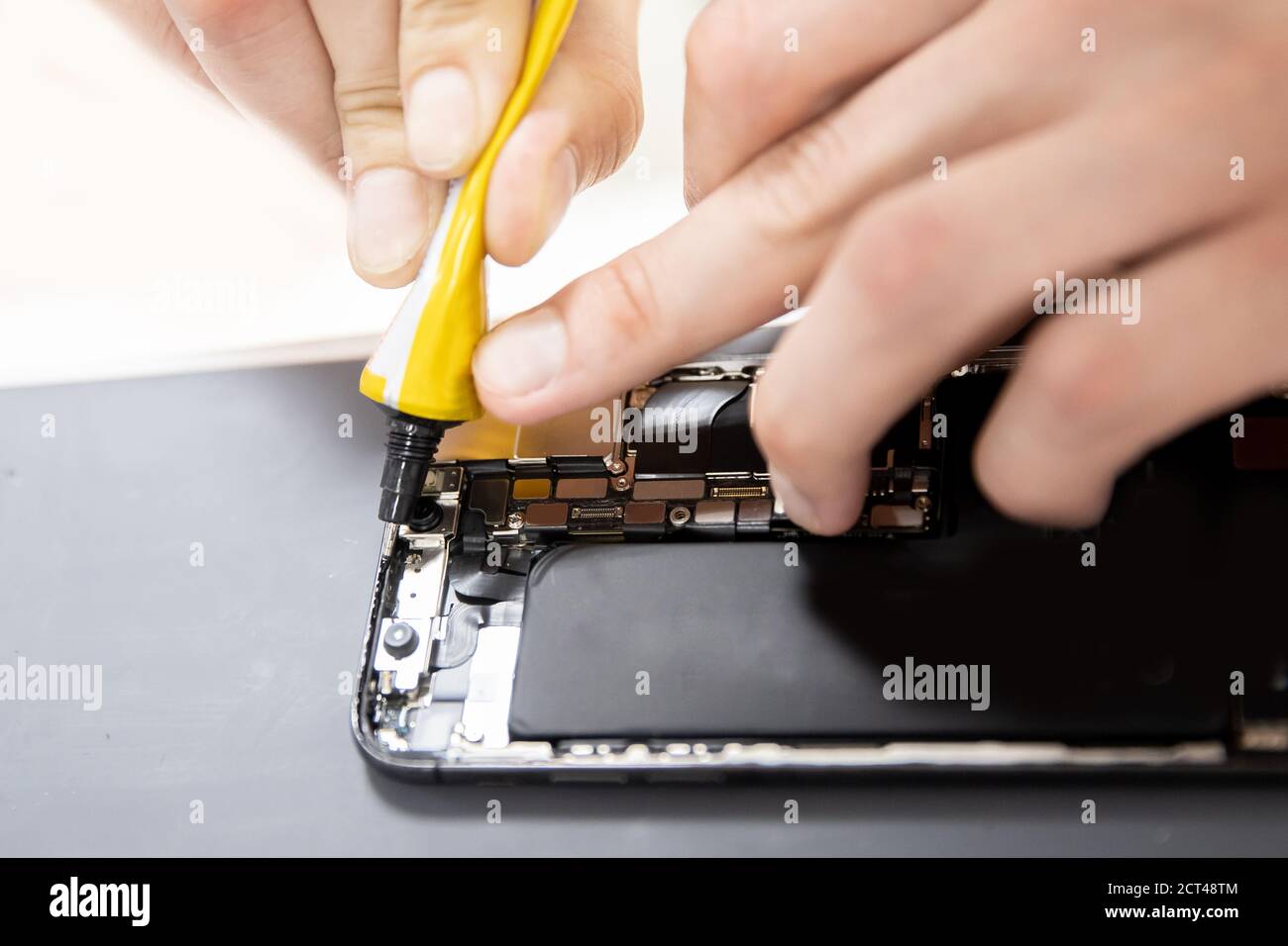 Process of applying silicone to seal and repair mobile phone when