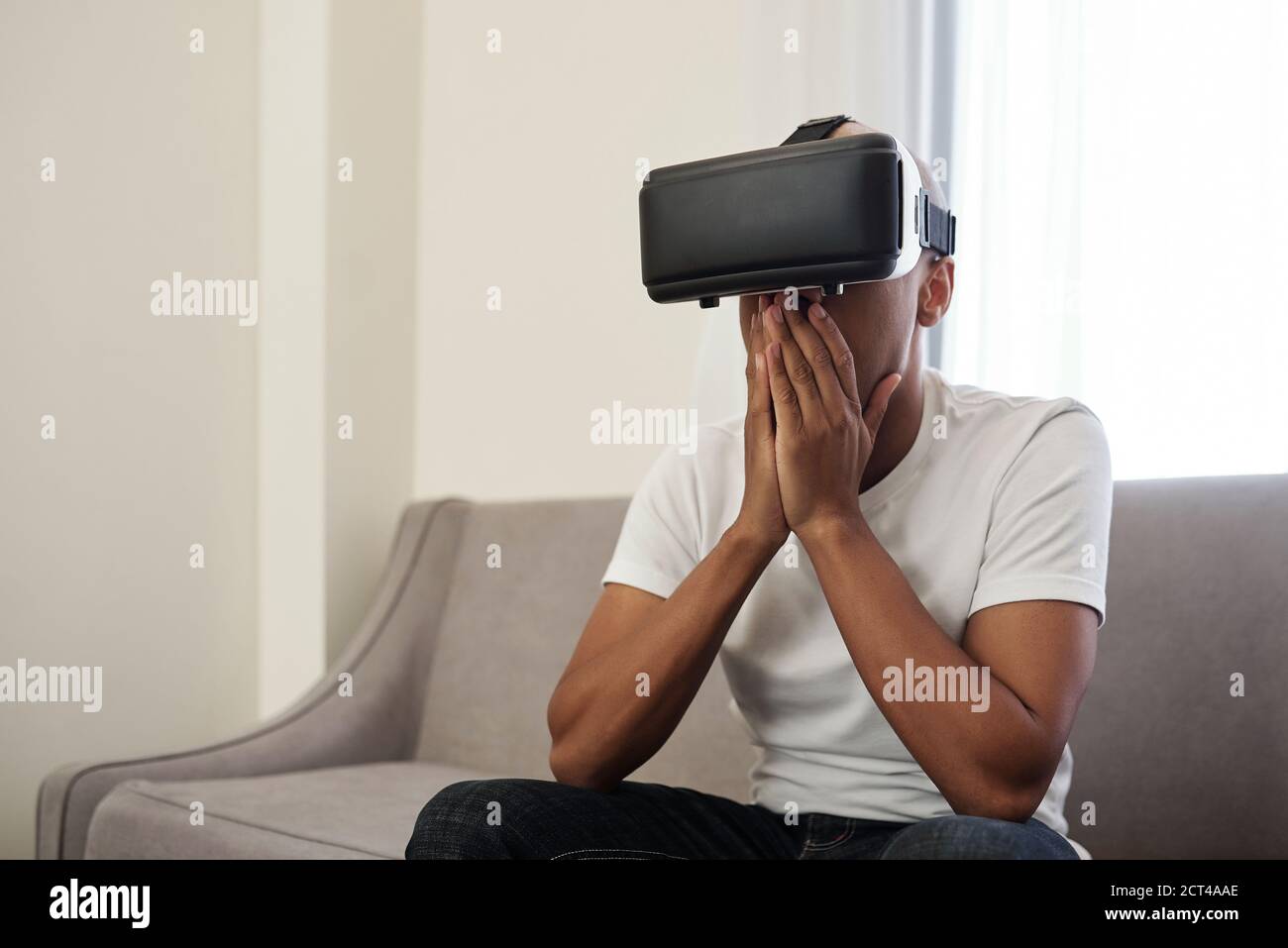 Shocked man in VR glasses Stock Photo