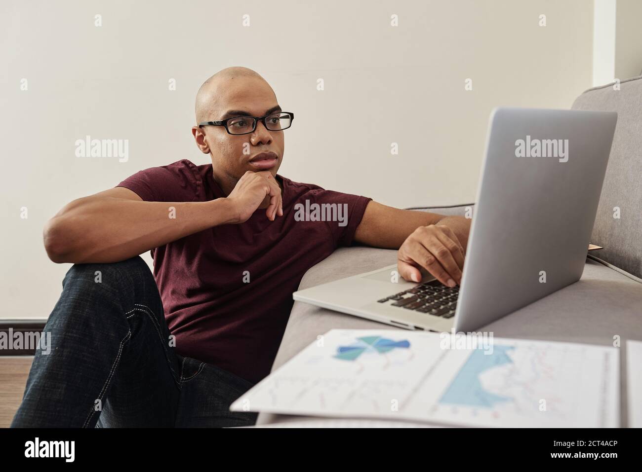 Pensive entrepreneur working from home Stock Photo